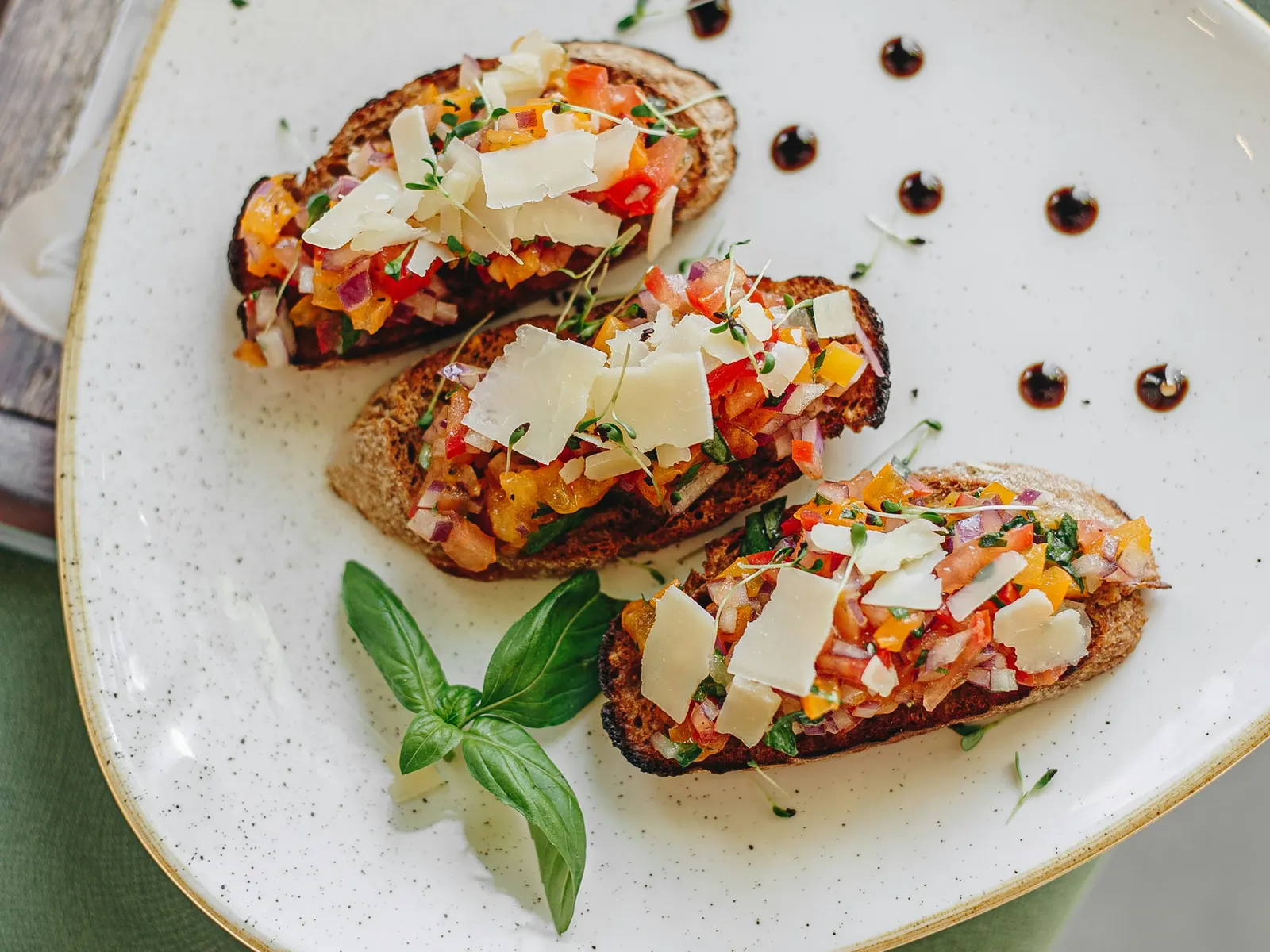Cottage cheese toast topped with tomatoes and basil