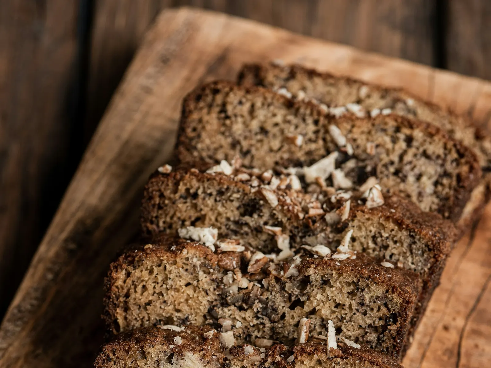 Slices of protein banana bread on a wooden board