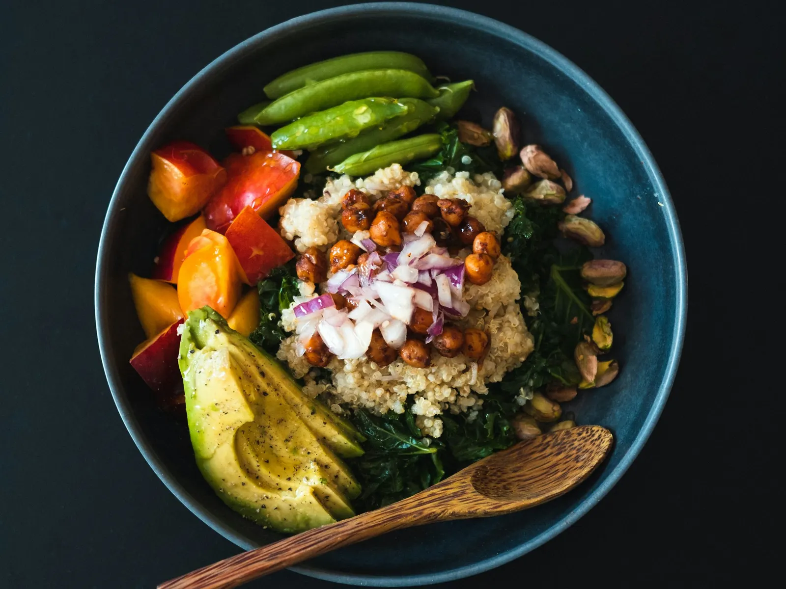Quinoa salad bowl with vegetables and avocado